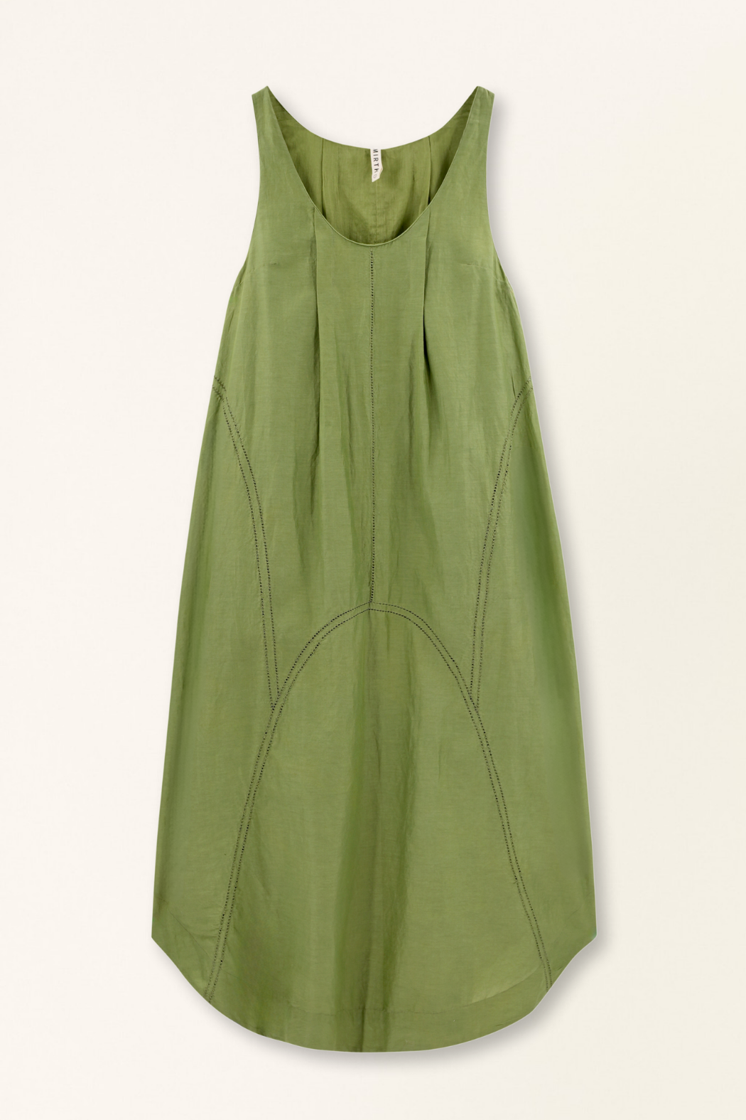 Green cotton dress on a hanger in store