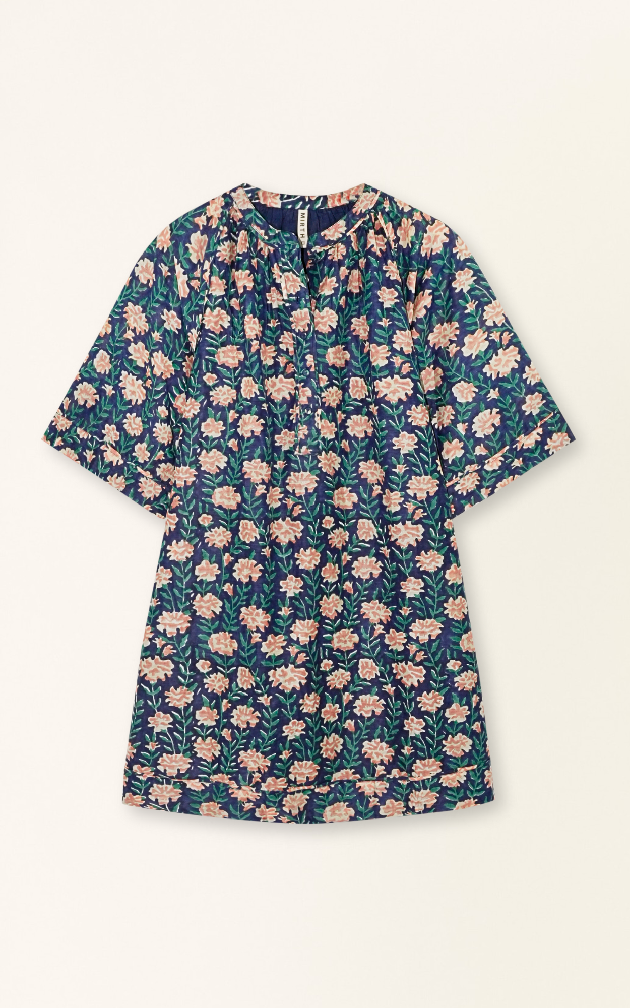 Pink cotton short dress on a hanger in store