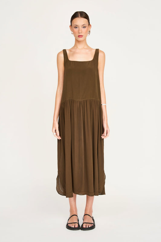 Brown silk midi dress on a hanger in store