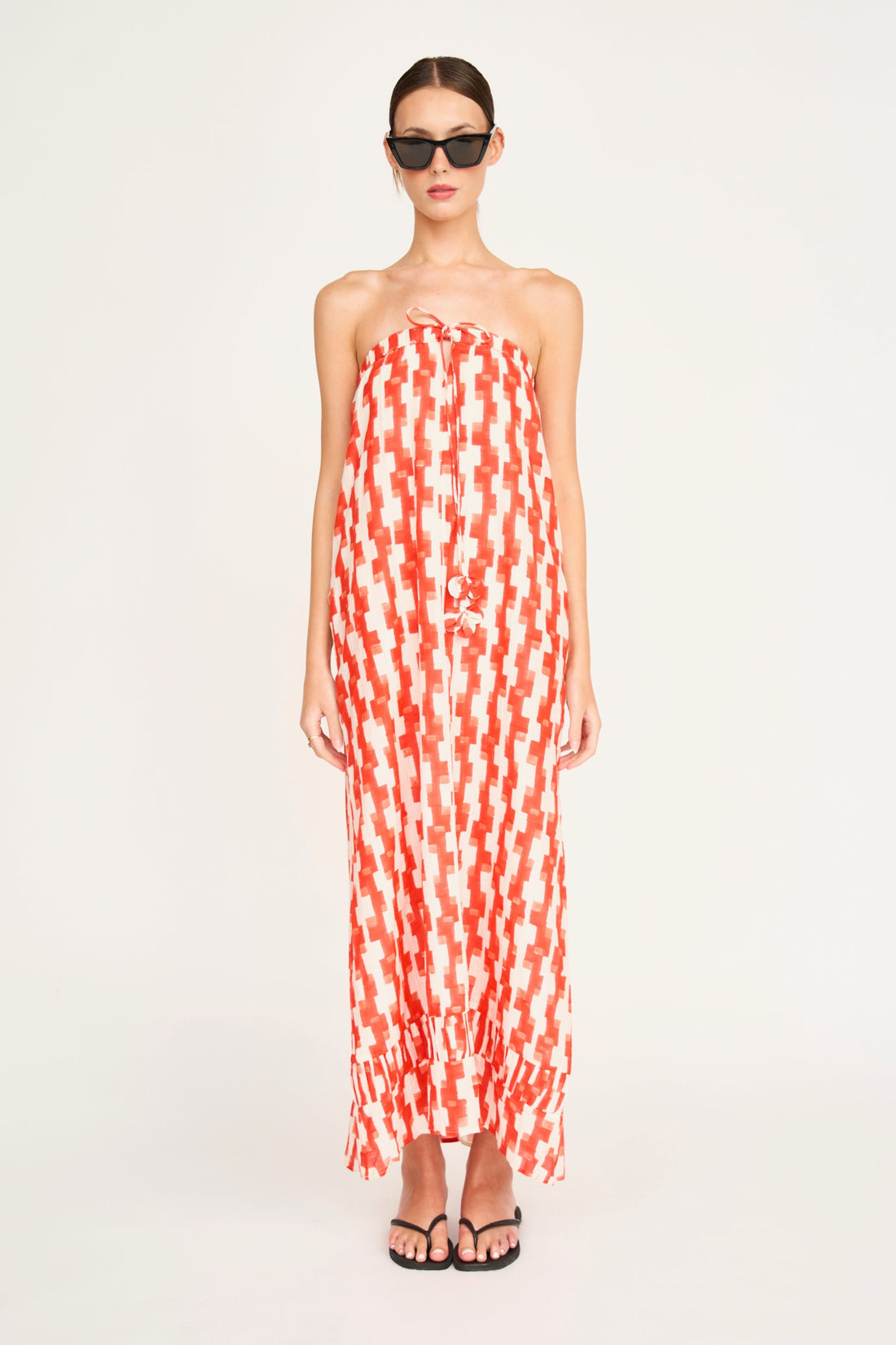 Red cotton maxi dress on a hanger in store