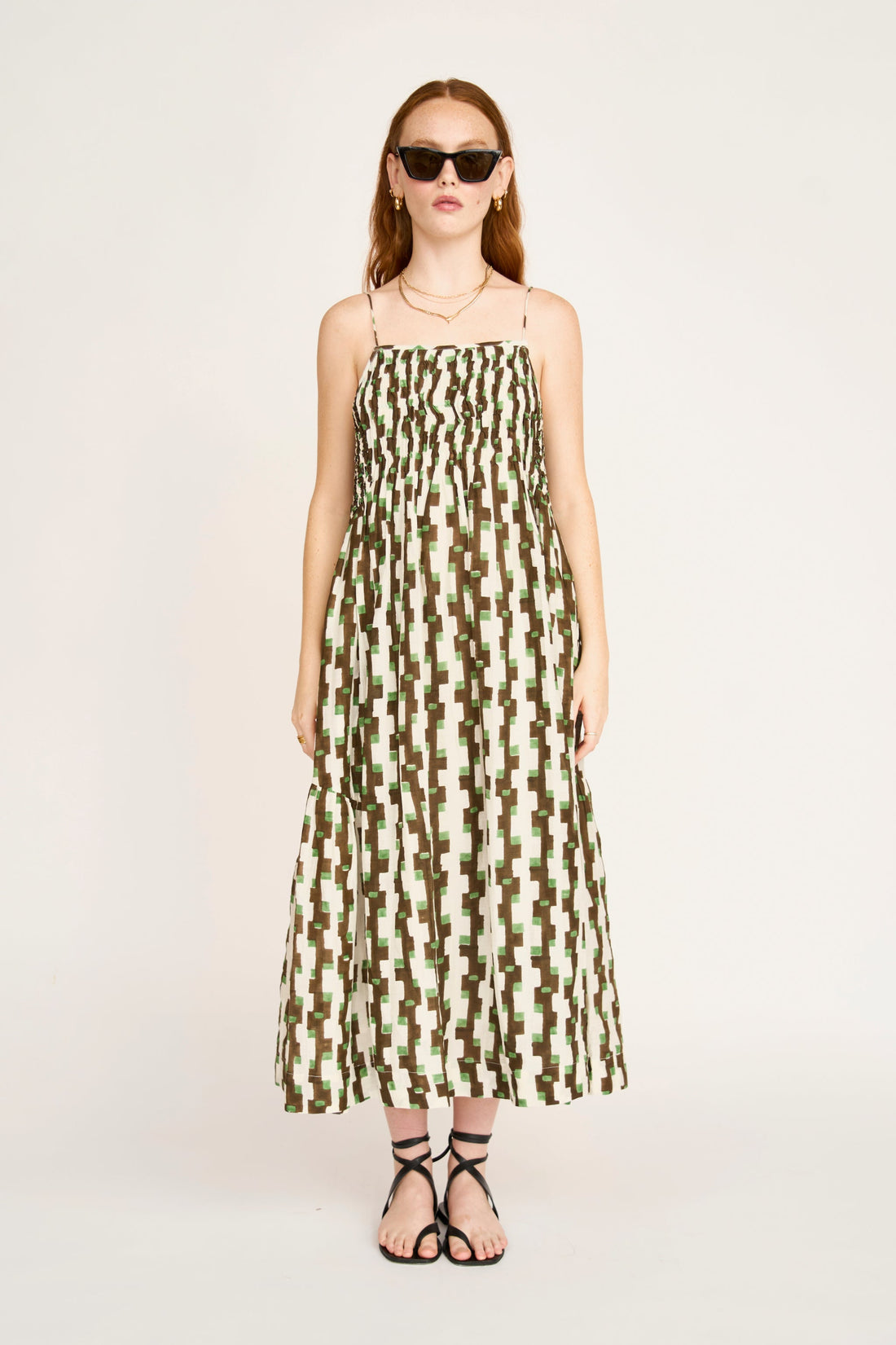 Brown cotton maxi dress on a hanger in store