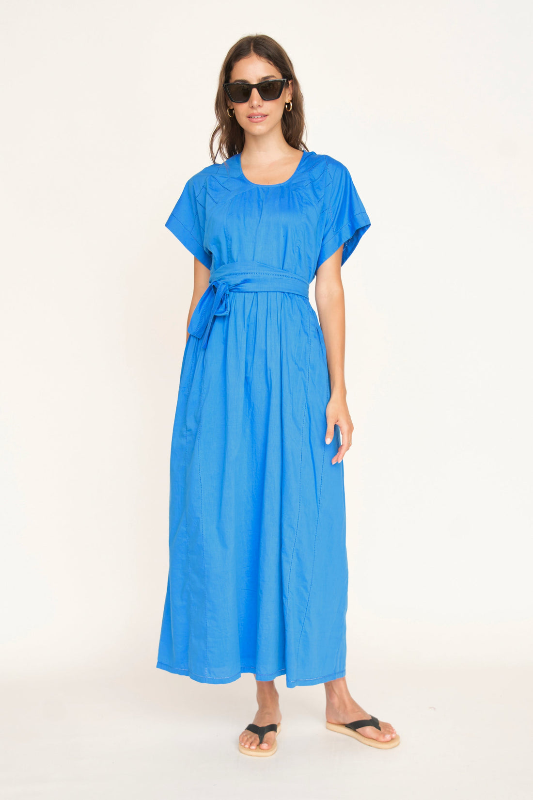 Blue cotton dress on a hanger in store