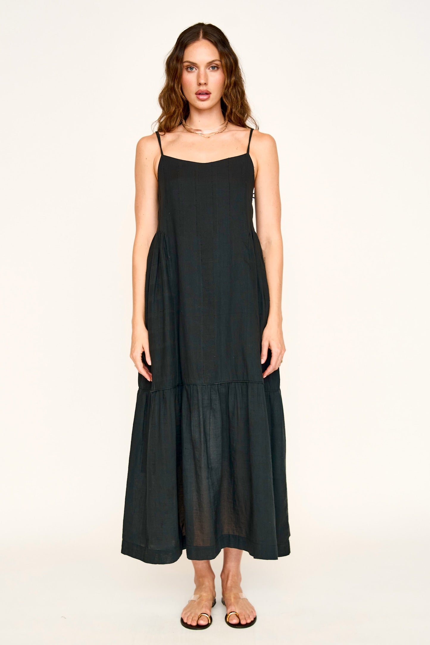 Black cotton maxi dress on a hanger in store