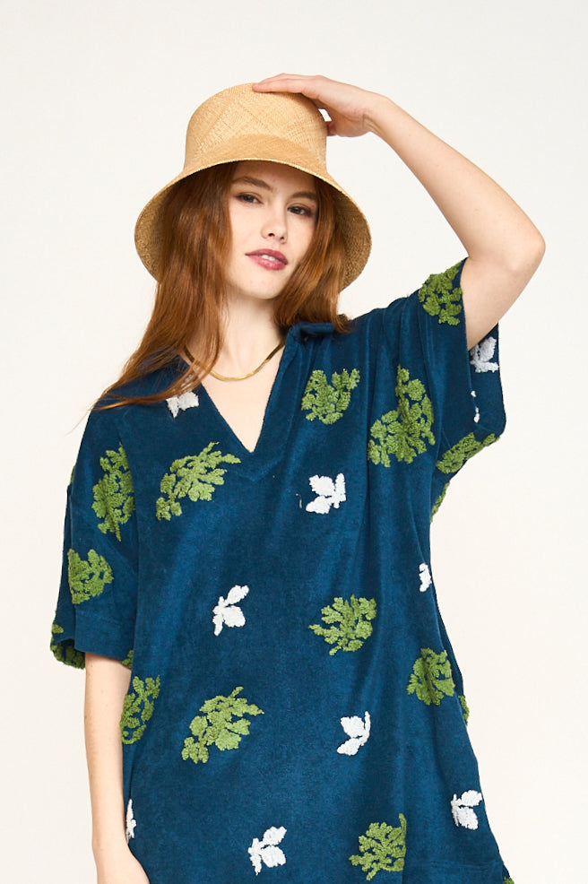 Terry short dress on a hanger in store