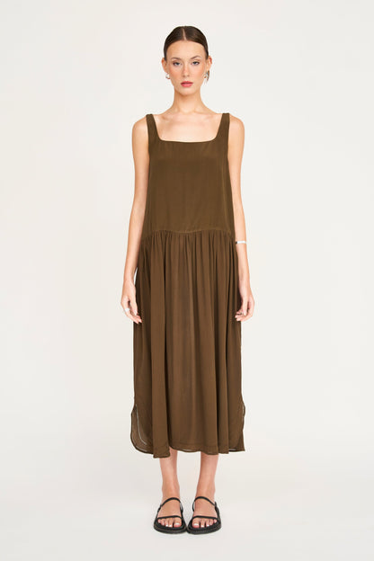 Brown silk midi dress on a hanger in store