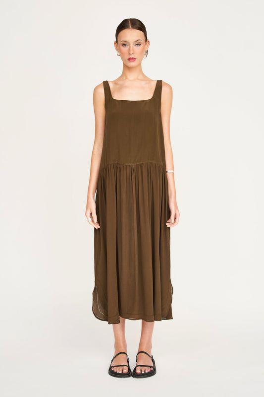 Brown silk midi dress on a hanger in store