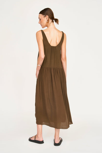 Brown silk midi dress on a hanger in store