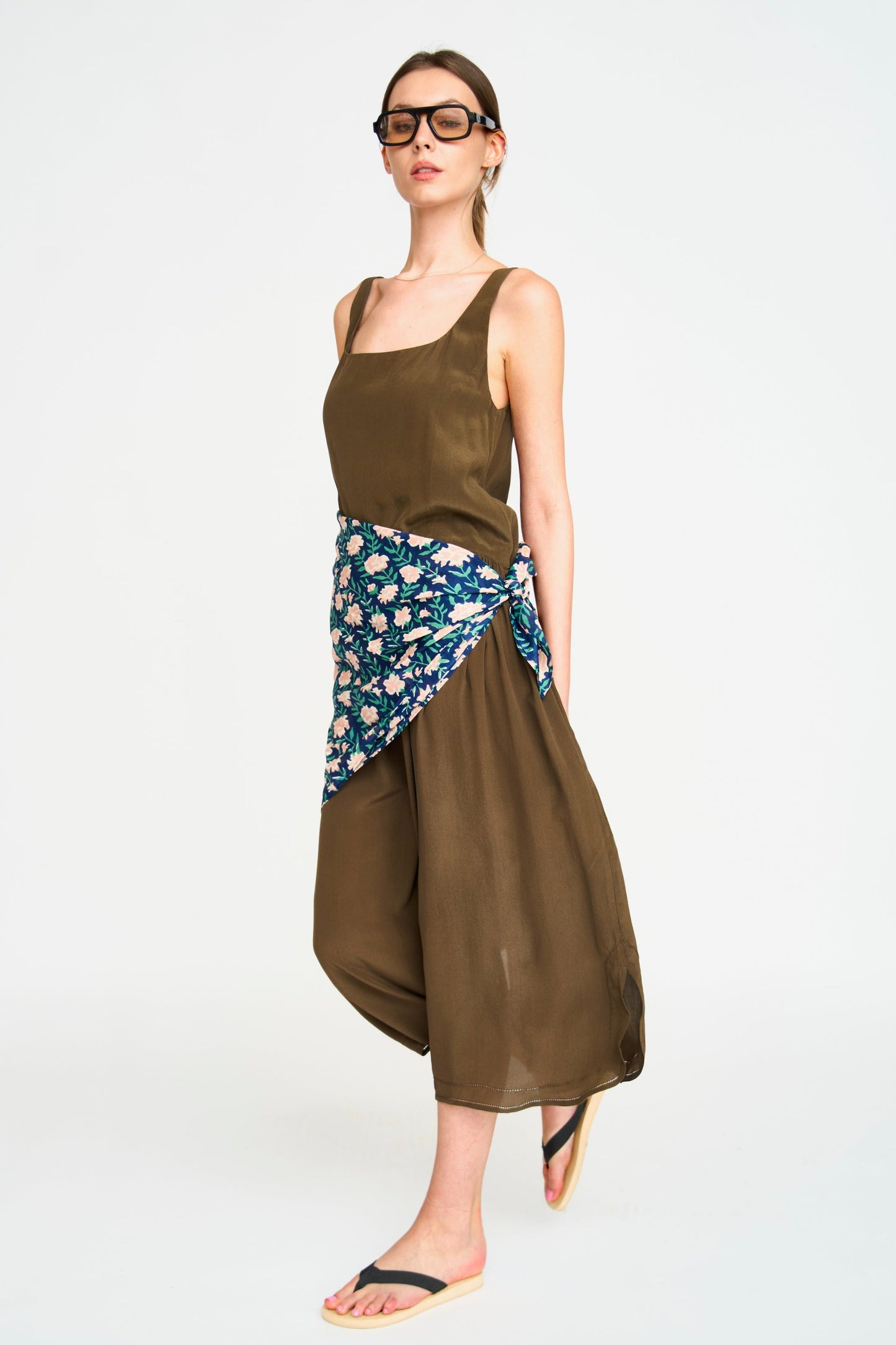 Brown silk midi dress on a hanger in store