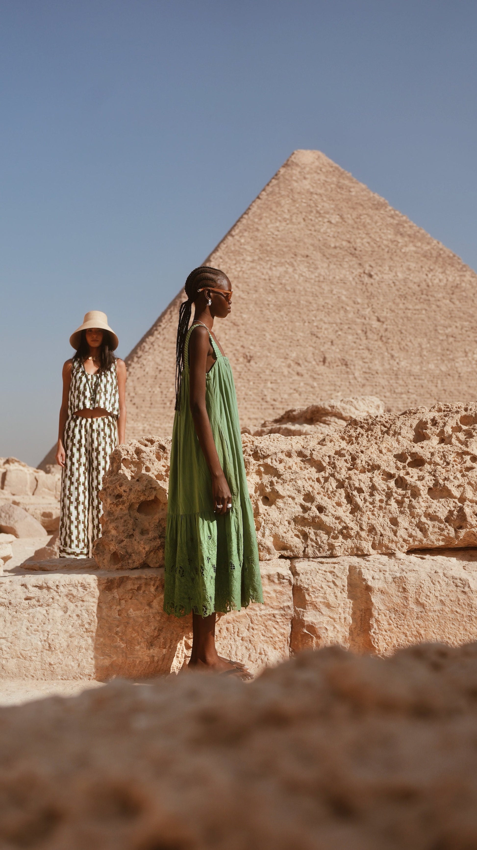 Green eyelet dress on a hanger in store