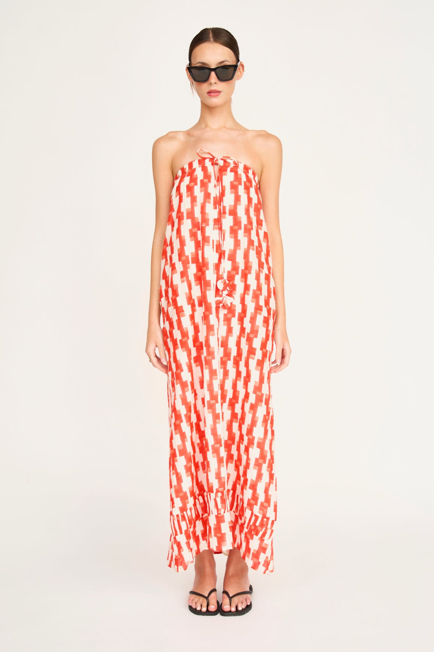 Red cotton maxi dress on a hanger in store
