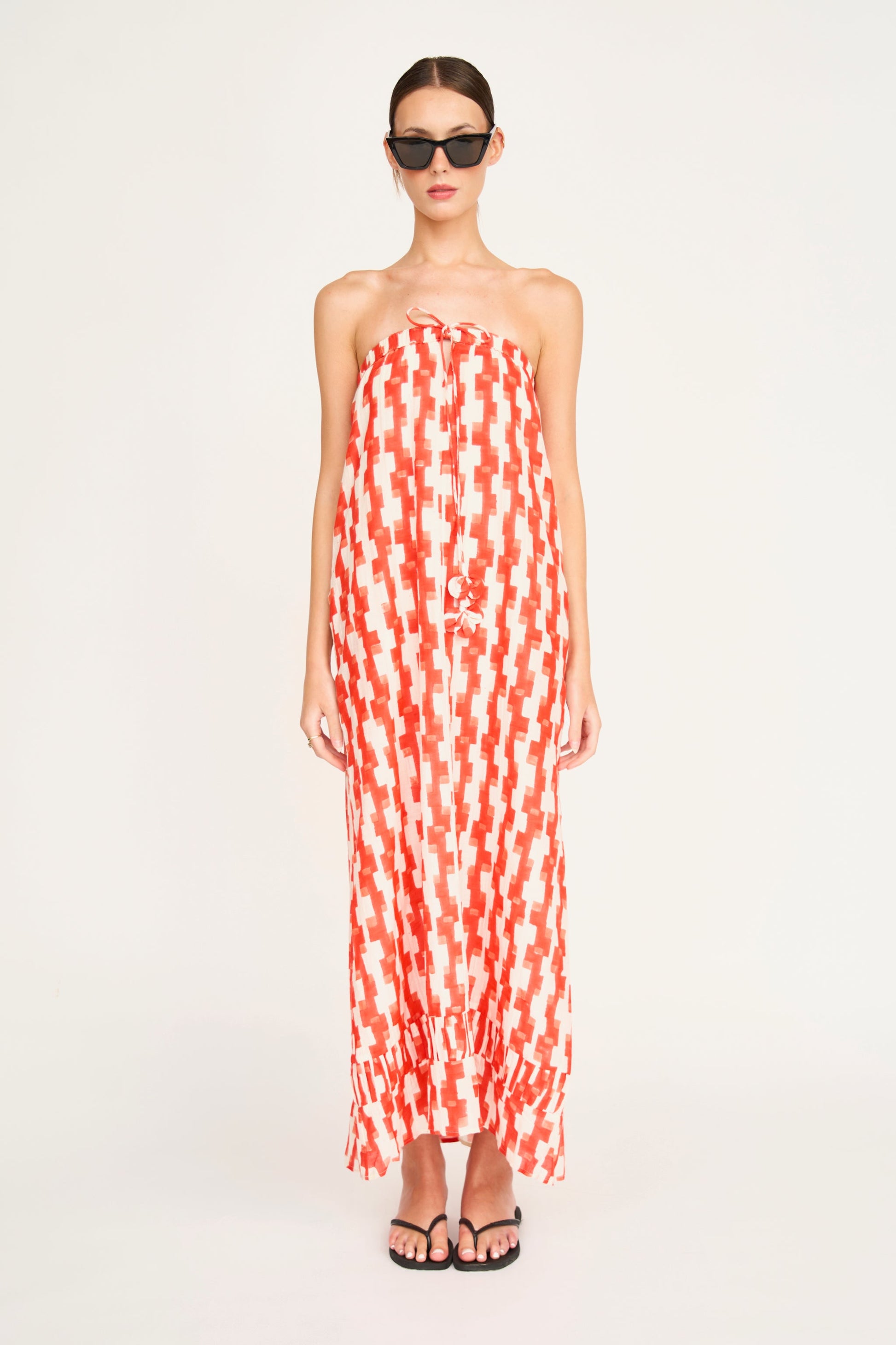 Red cotton maxi dress on a hanger in store