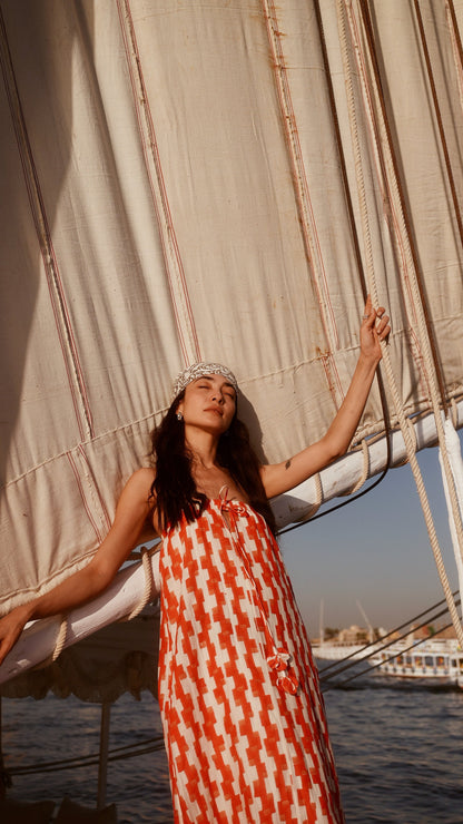 Red cotton maxi dress on a hanger in store