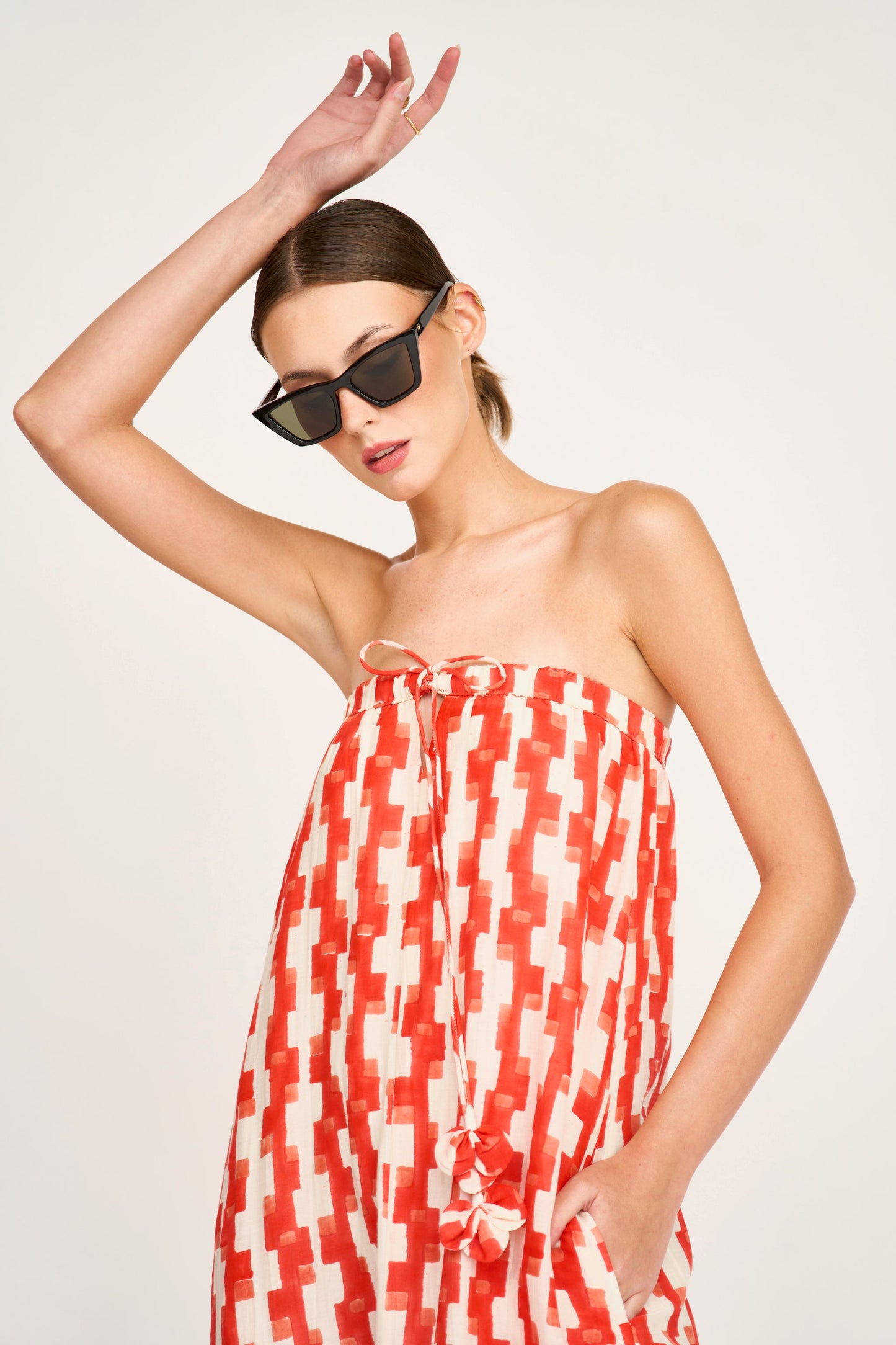 Red cotton maxi dress on a hanger in store