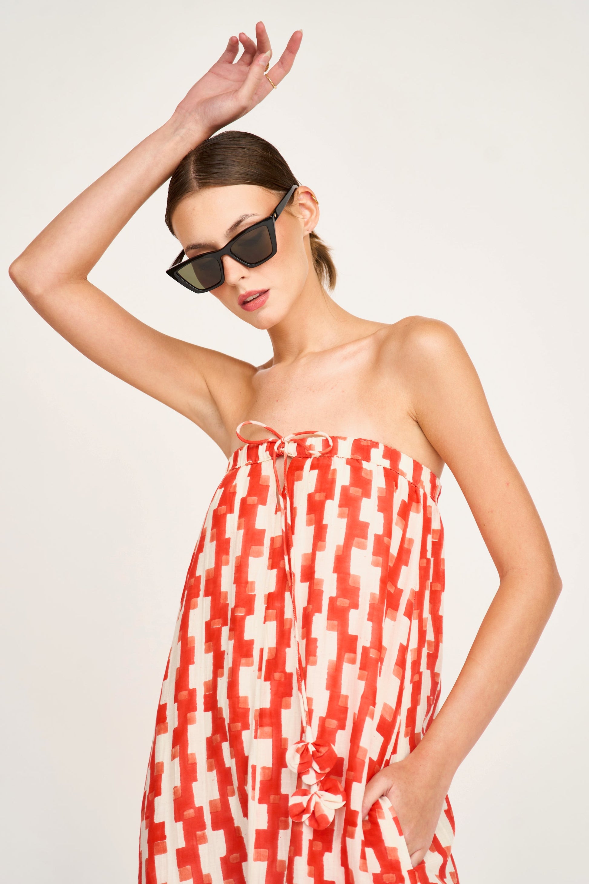 Red cotton maxi dress on a hanger in store