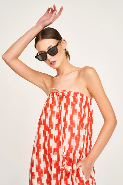 Red cotton maxi dress on a hanger in store