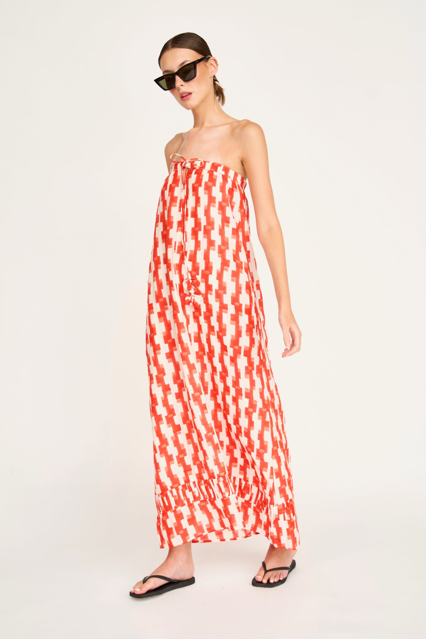 Red cotton maxi dress on a hanger in store