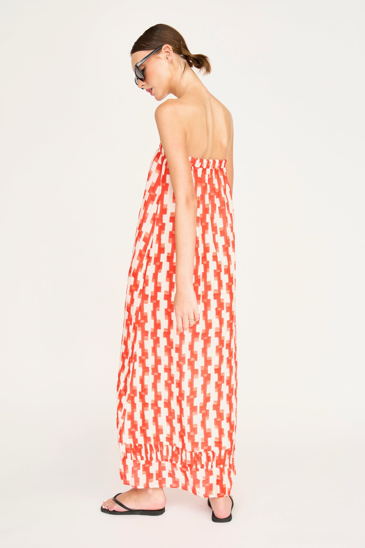 Red cotton maxi dress on a hanger in store