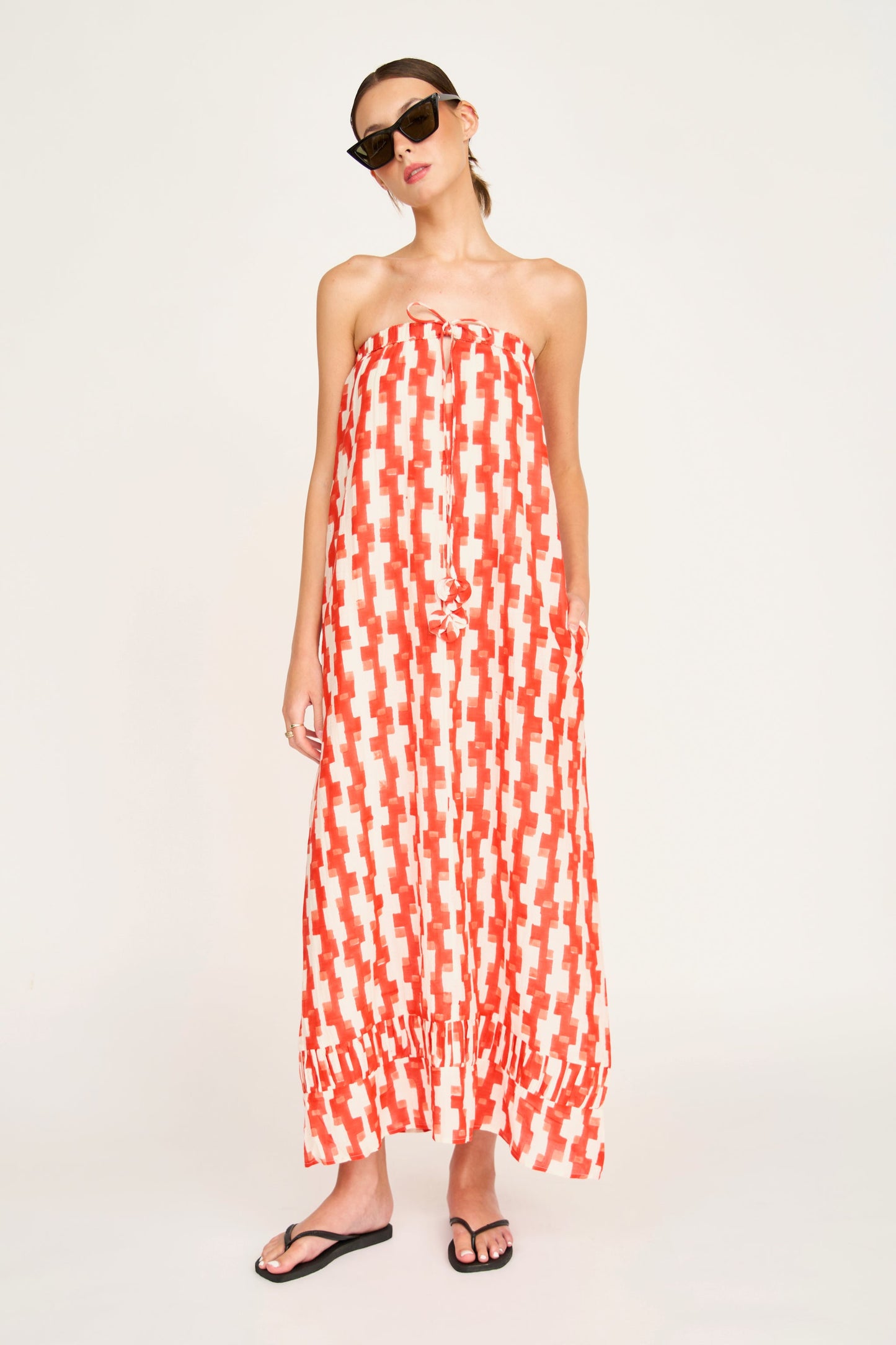 Red cotton maxi dress on a hanger in store