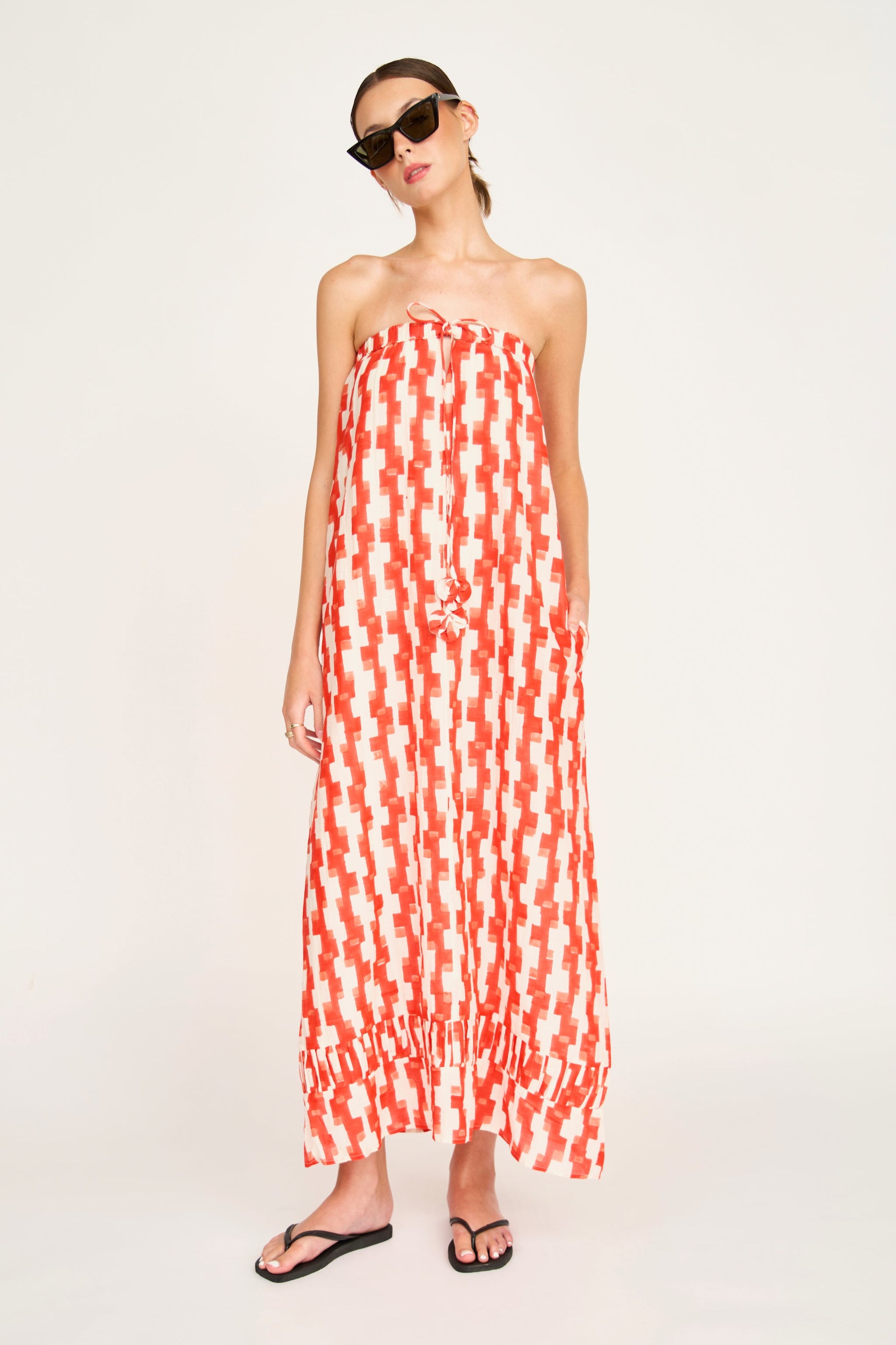 Red cotton maxi dress on a hanger in store
