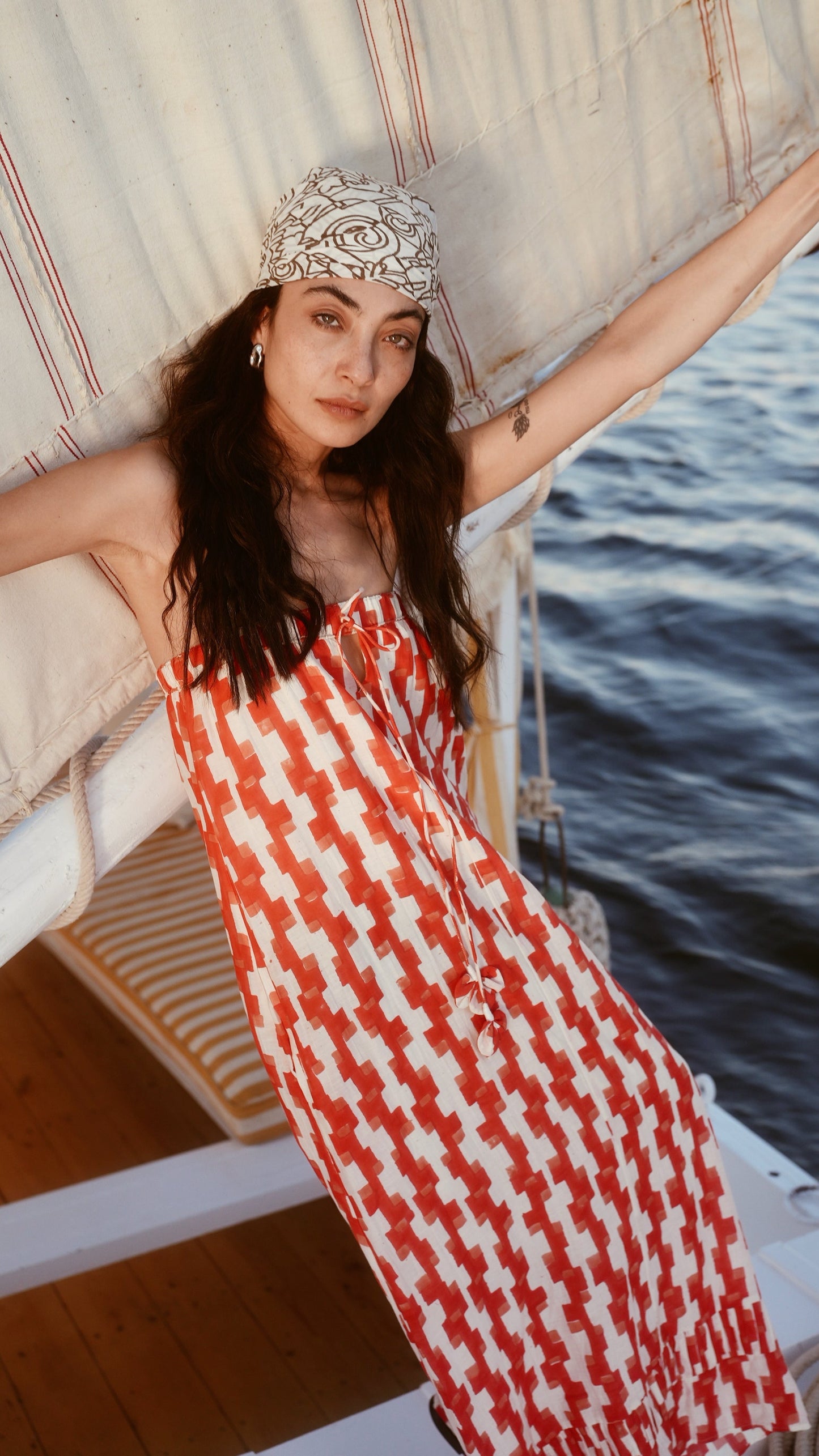 Red cotton maxi dress on a hanger in store