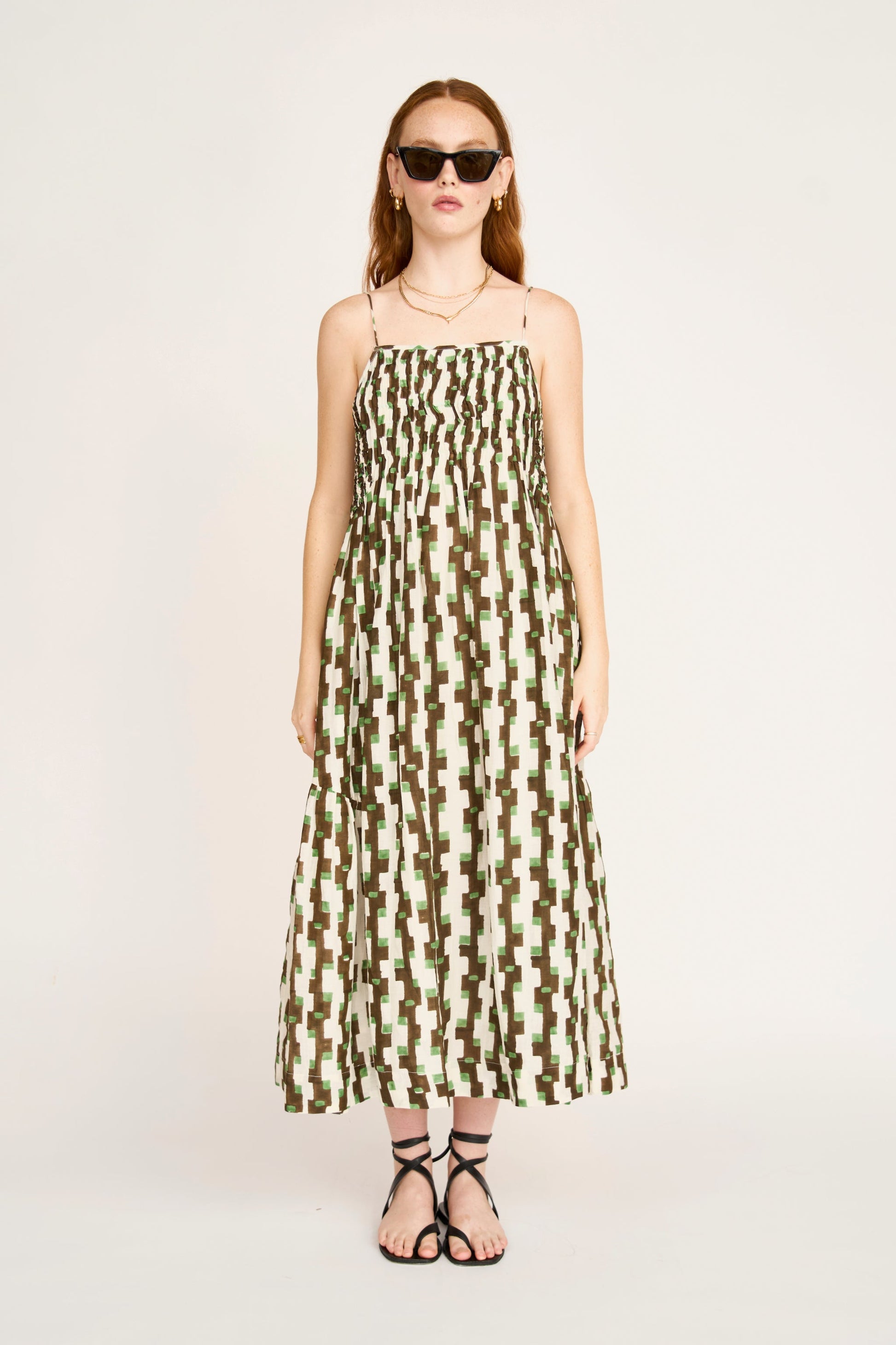 Brown cotton maxi dress on a hanger in store
