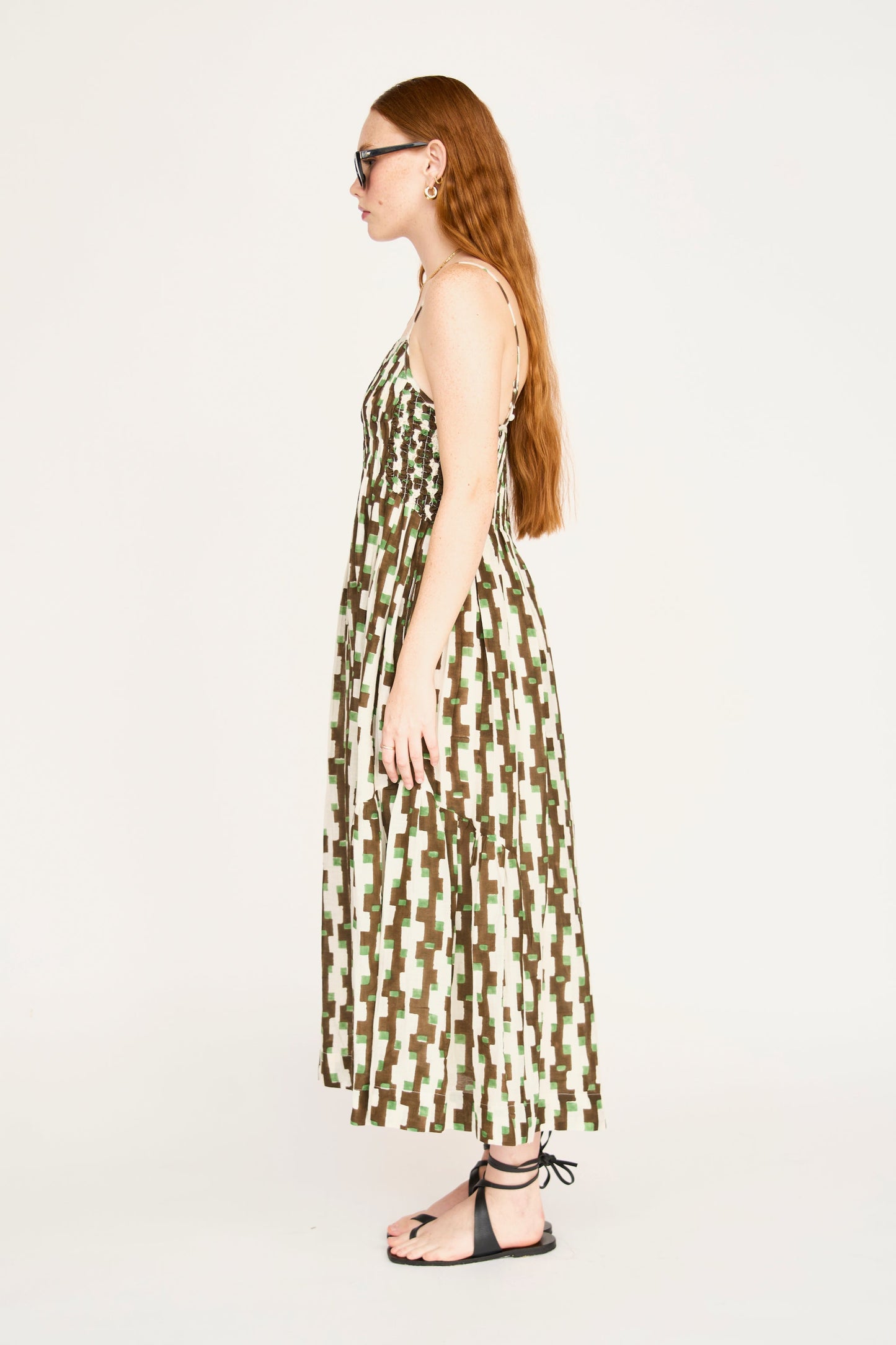 Brown cotton maxi dress on a hanger in store