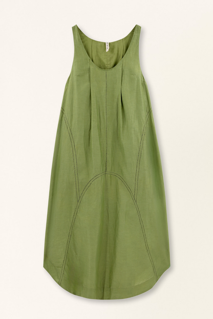 Green cotton dress on a hanger in store