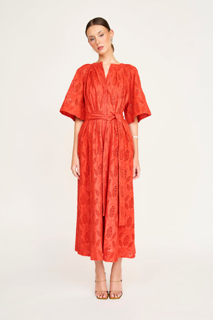 Red eyelet maxi dress on a hanger in store