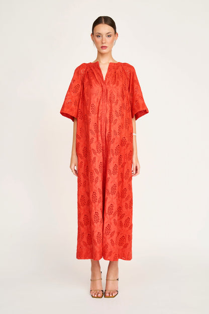 Red eyelet maxi dress on a hanger in store