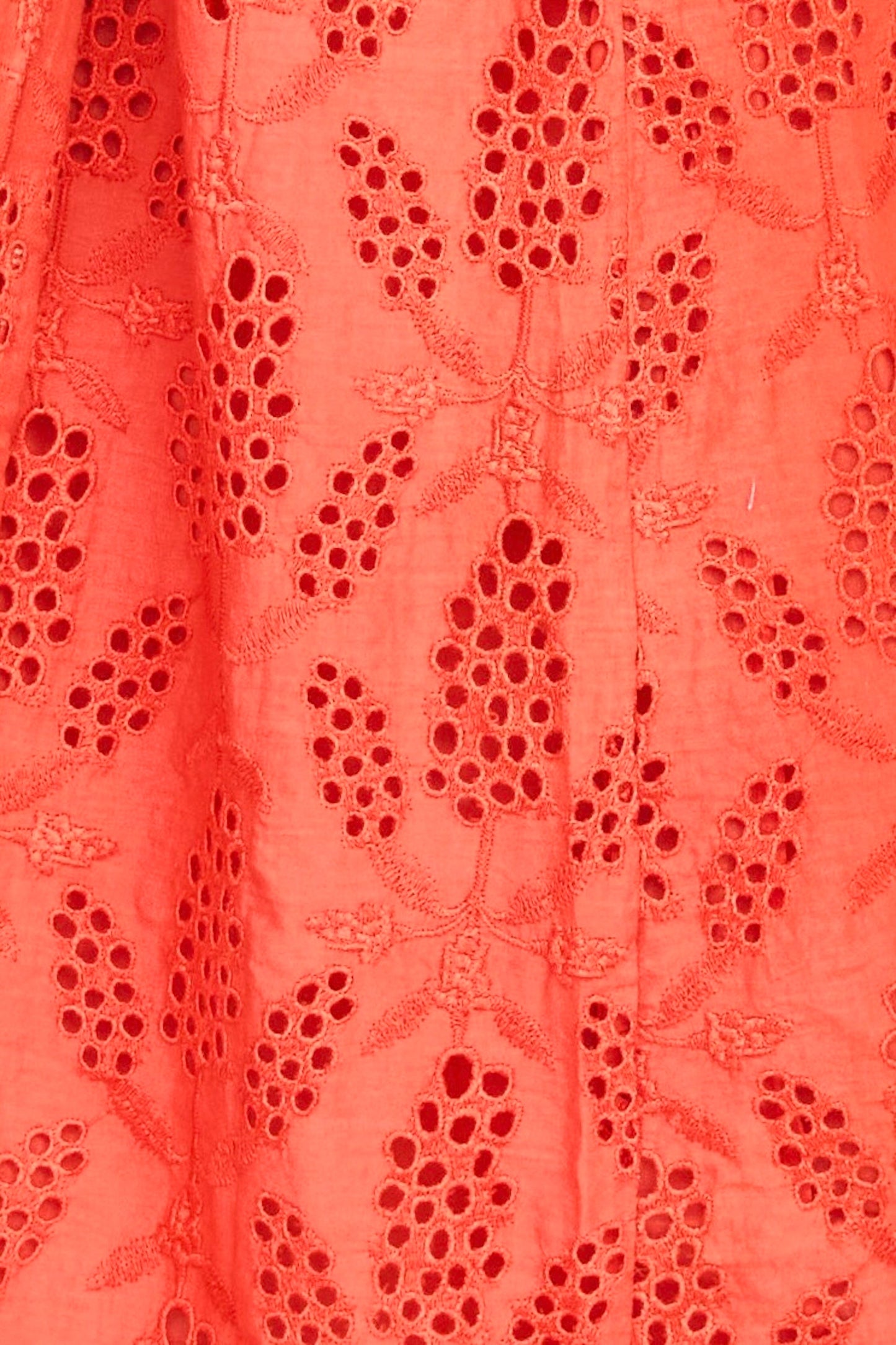 Red eyelet maxi dress on a hanger in store