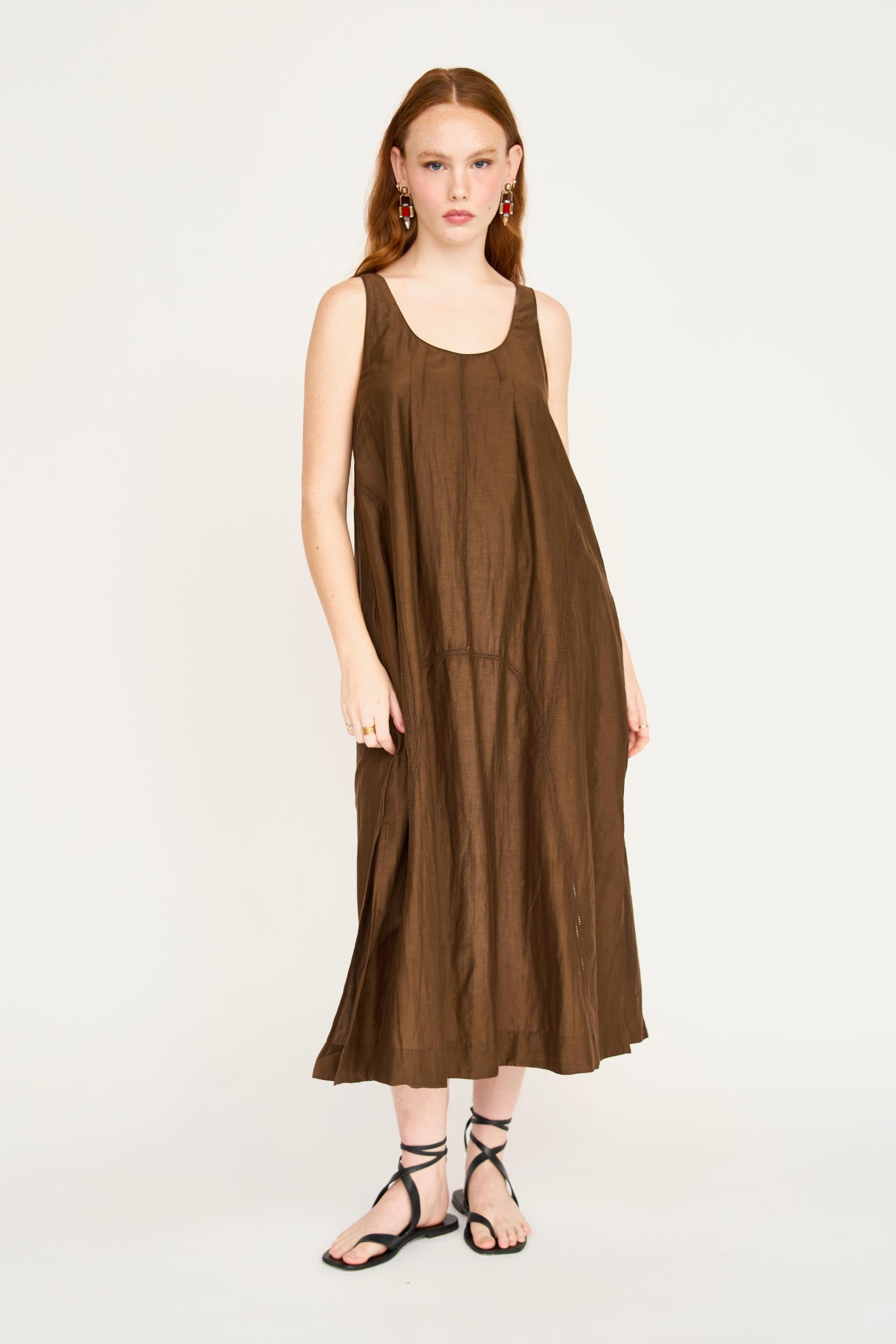 Brown cotton dress on a hanger in store