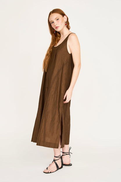 Brown cotton dress on a hanger in store