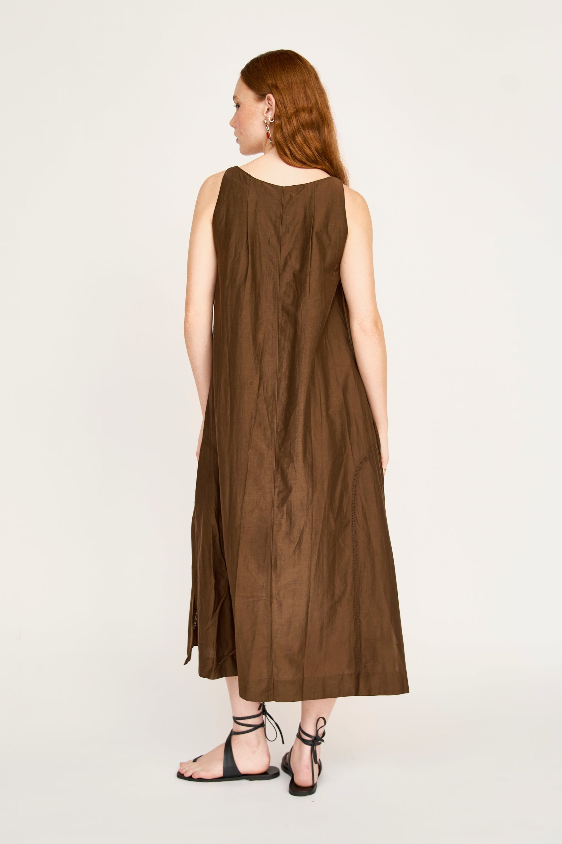 Brown cotton dress on a hanger in store