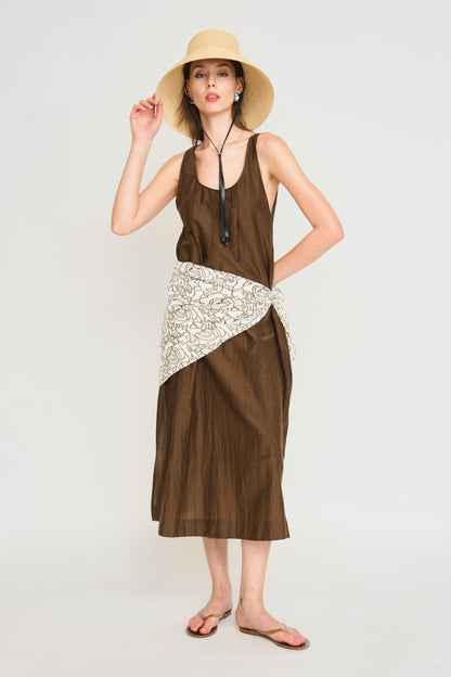 Brown cotton dress on a hanger in store