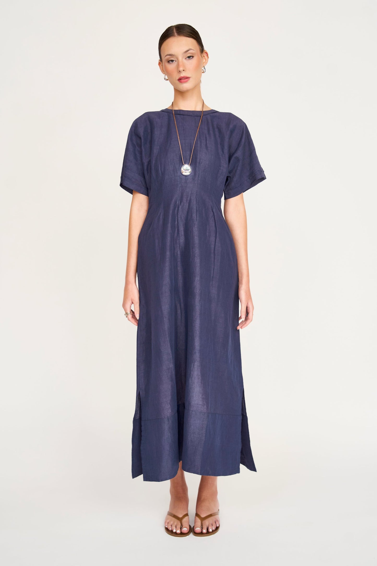 Blue linen maxi dress on a hanger in store
