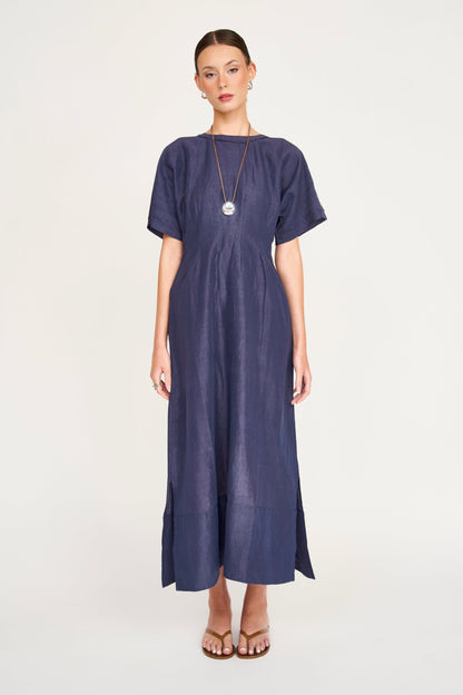 Blue linen maxi dress on a hanger in store