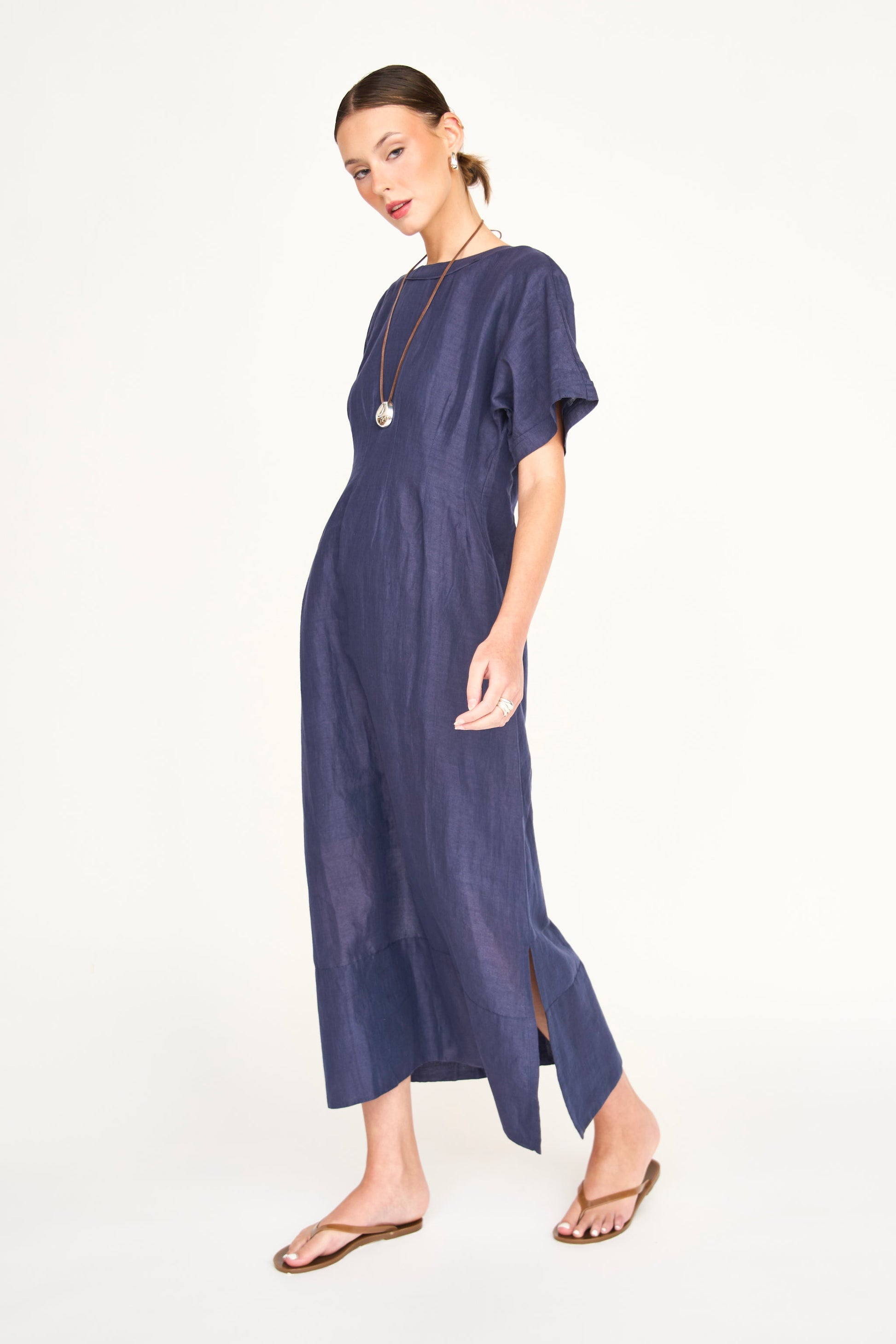 Blue linen maxi dress on a hanger in store