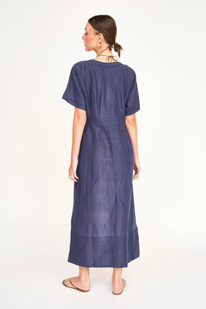 Blue linen maxi dress on a hanger in store