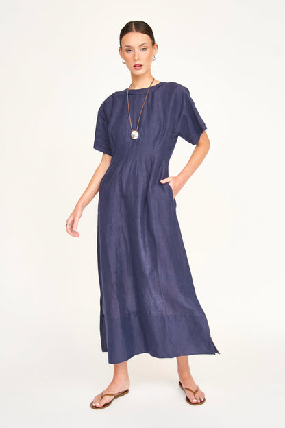 Blue linen maxi dress on a hanger in store
