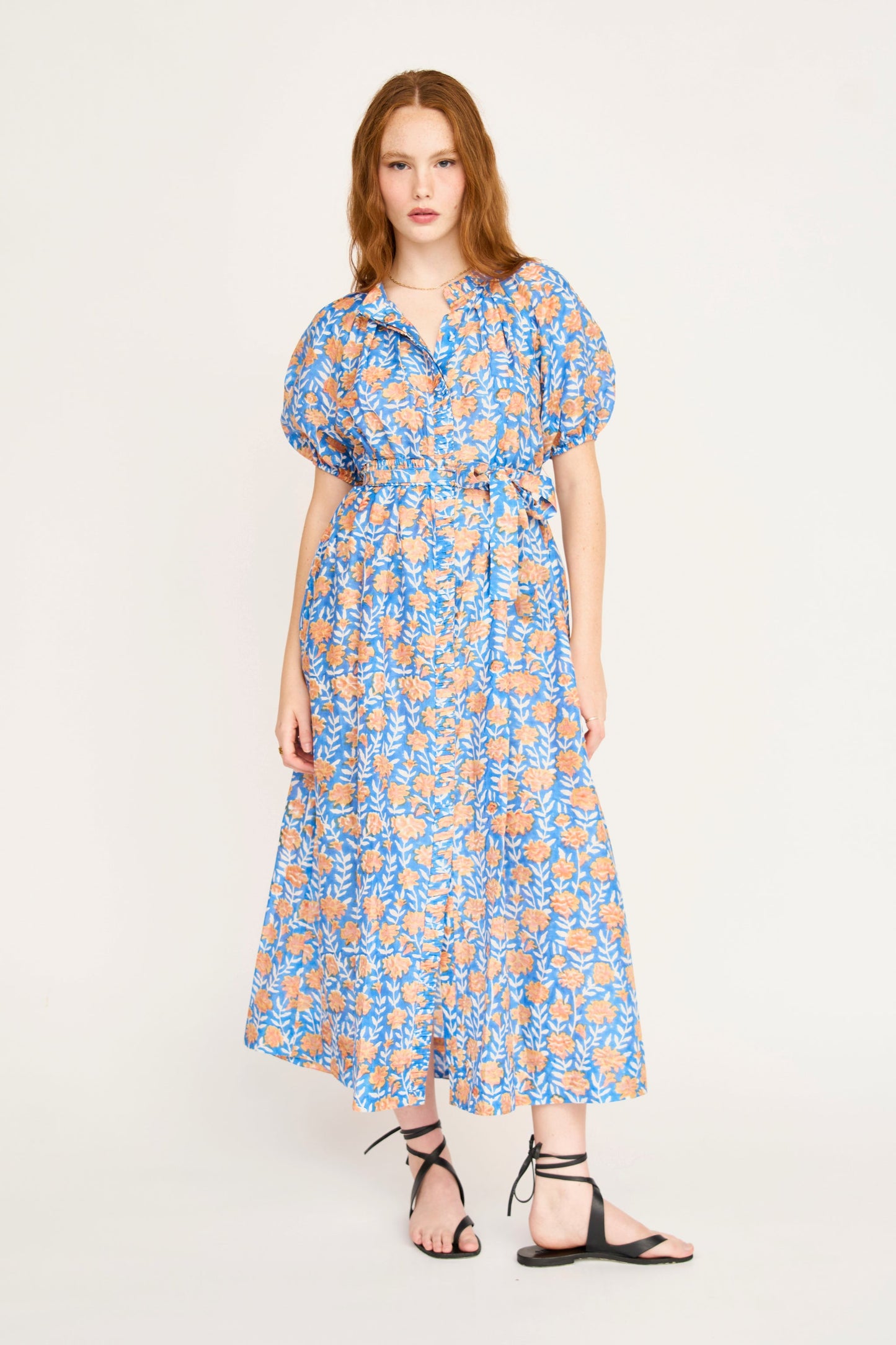 Pink cotton maxi dress on a hanger in store