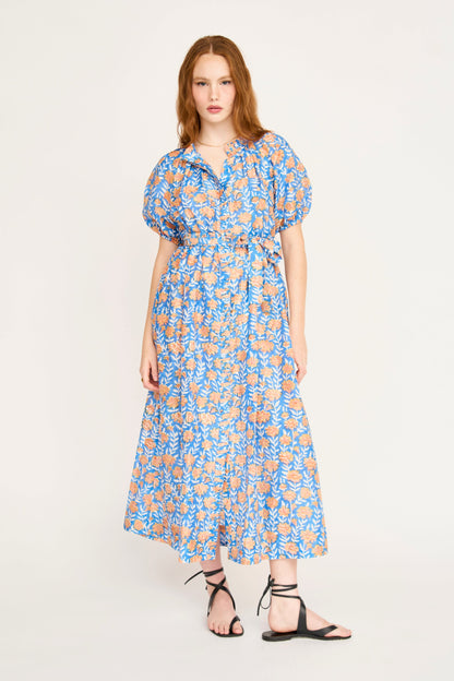 Pink cotton maxi dress on a hanger in store