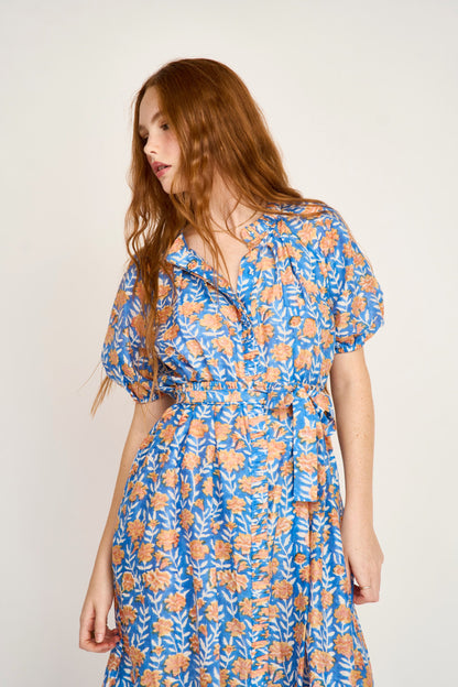 Pink cotton maxi dress on a hanger in store