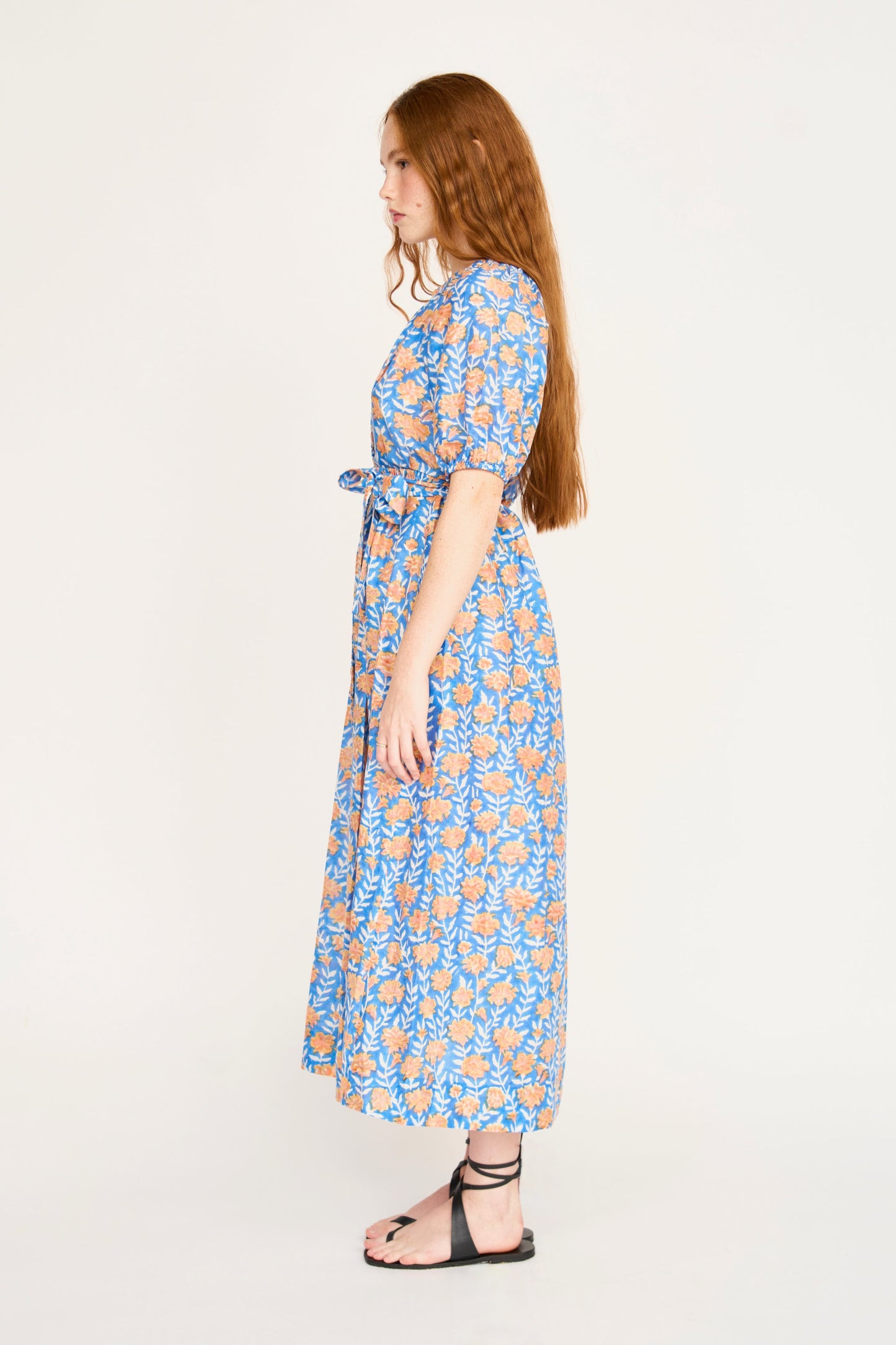 Pink cotton maxi dress on a hanger in store