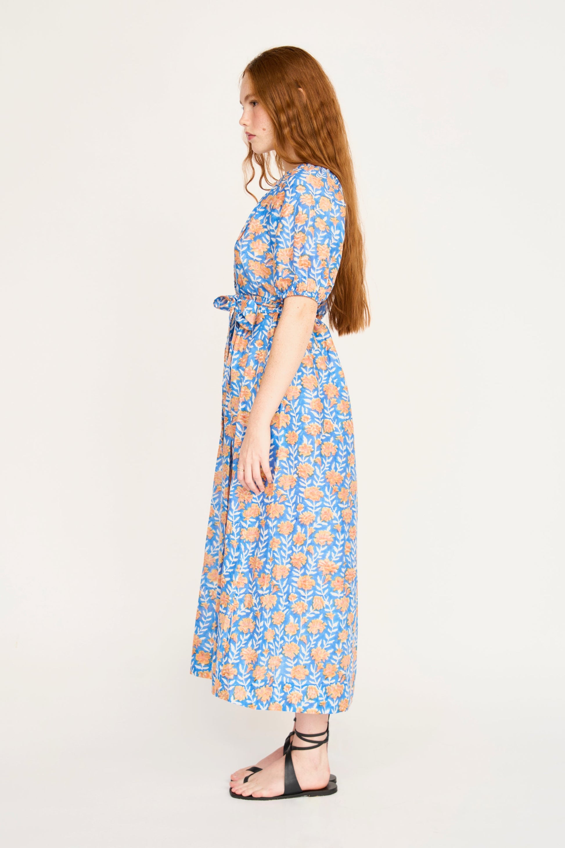 Pink cotton maxi dress on a hanger in store