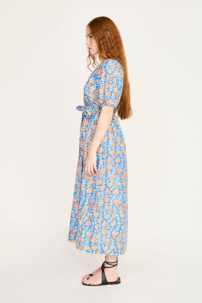 Pink cotton maxi dress on a hanger in store
