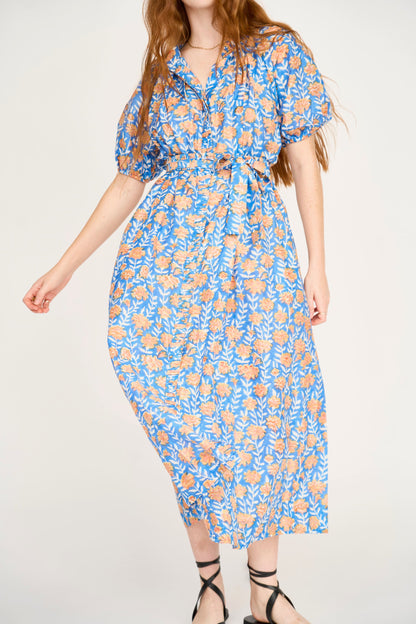 Pink cotton maxi dress on a hanger in store