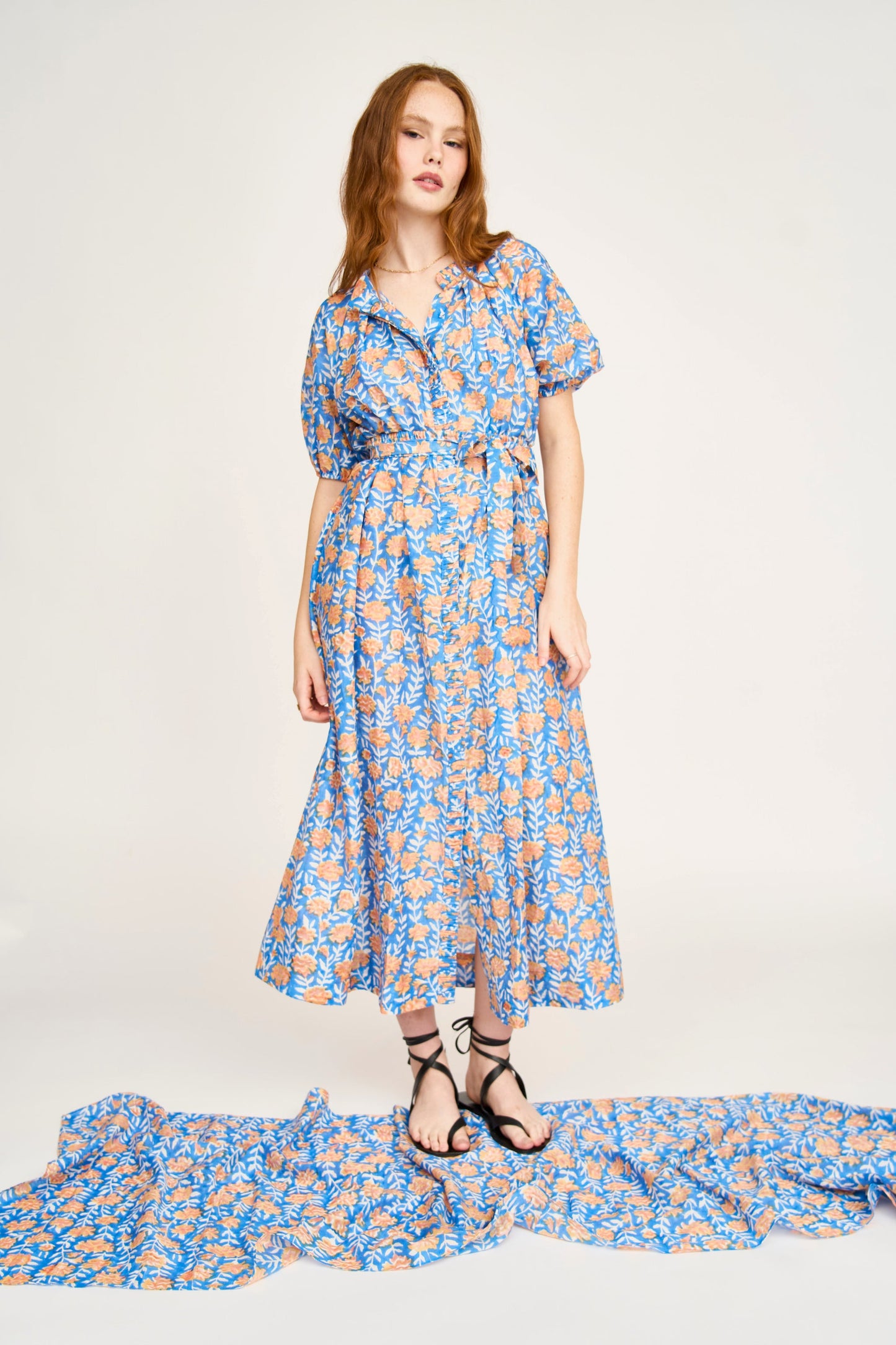 Pink cotton maxi dress on a hanger in store