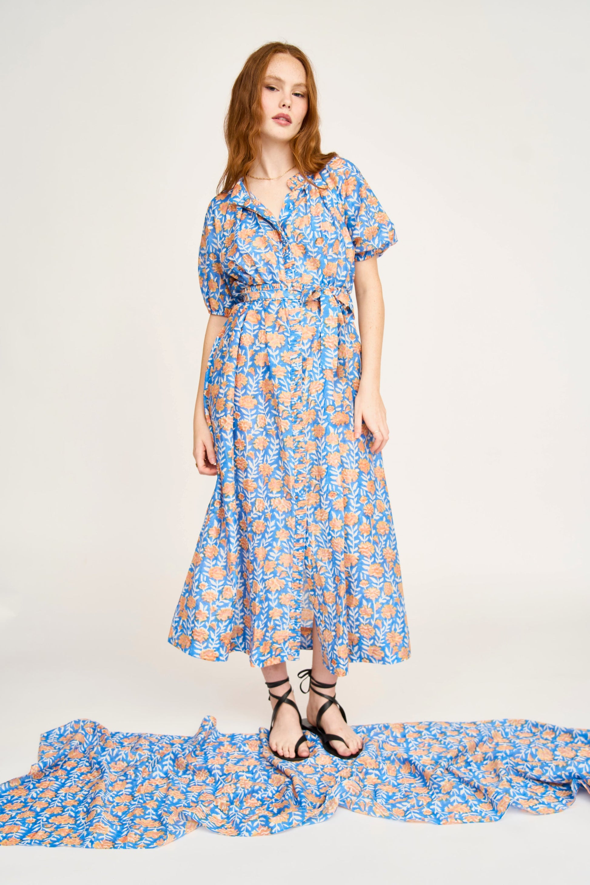 Pink cotton maxi dress on a hanger in store
