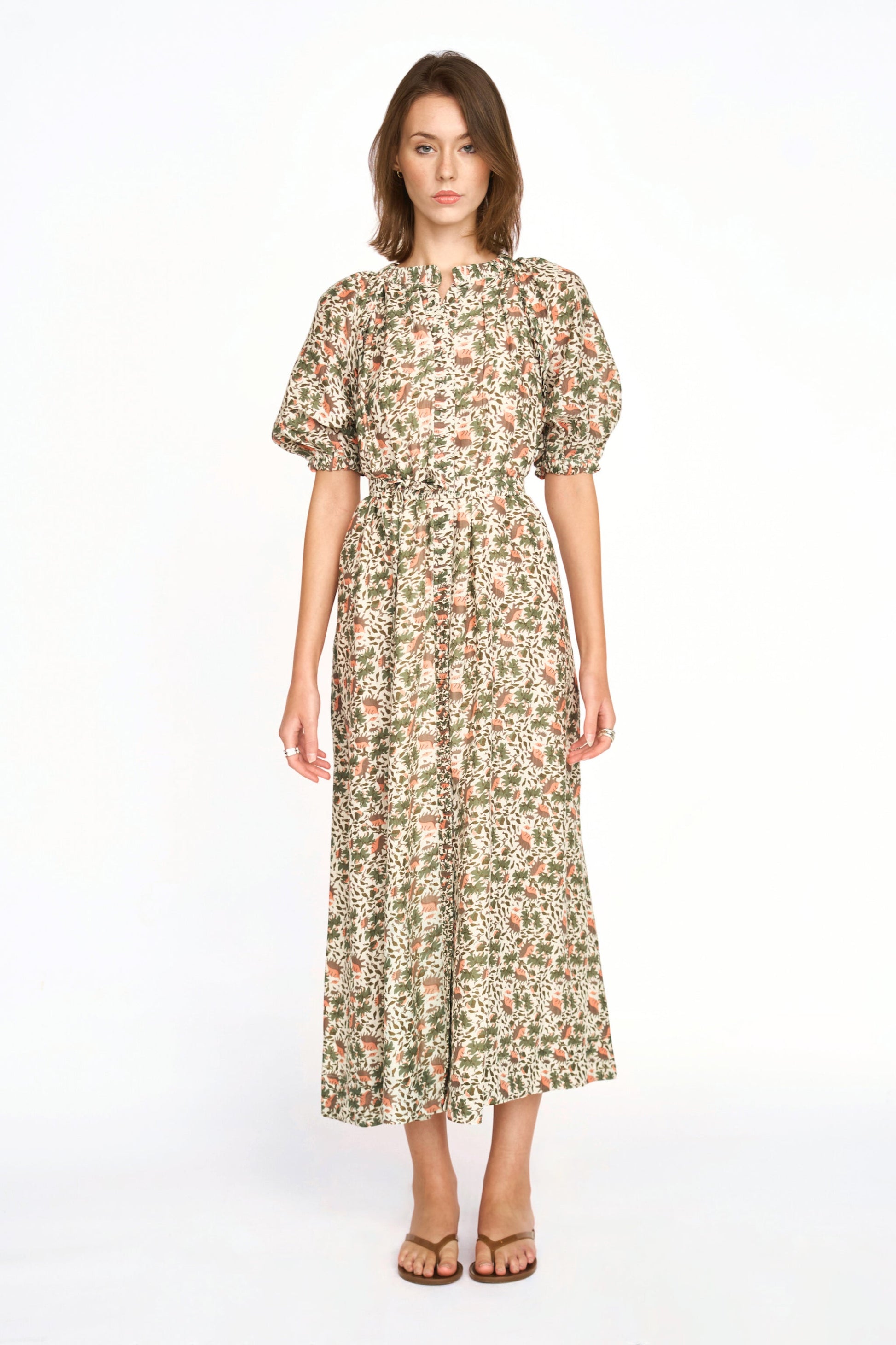 Pink cotton maxi dress on a hanger in store