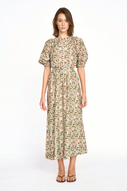 Pink cotton maxi dress on a hanger in store
